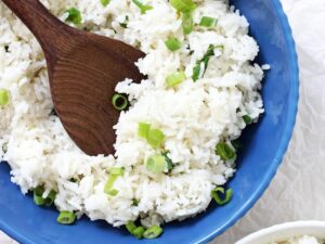 This slightly sticky basmati coconut rice is an excellent side dish to any entree! Savory, easy to make and packed with flavor! Including lime zest, coconut milk and green onion!