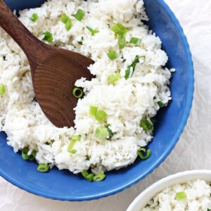 This slightly sticky basmati coconut rice is an excellent side dish to any entree! Savory, easy to make and packed with flavor! Including lime zest, coconut milk and green onion!