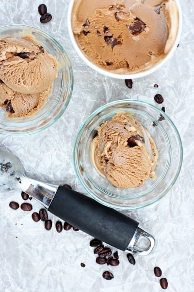 A container and two bowls of Mocha Chip Ice Cream.