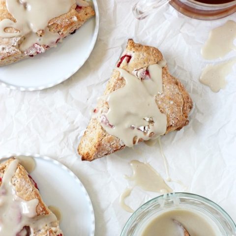 Soft and fluffy strawberries and cream scones! Filled with fresh strawberries and topped with a vanilla glaze, they are heavenly in every way!