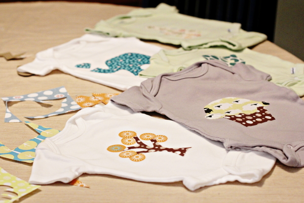Homemade onesies on a table.