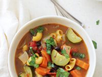 An easy, healthy and flavorful minestrone soup recipe! Filled with veggies, pasta and a touch of balsamic vinegar, this light vegetarian dish is a crowd pleaser for sure!