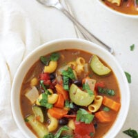 An easy, healthy and flavorful minestrone soup recipe! Filled with veggies, pasta and a touch of balsamic vinegar, this light vegetarian dish is a crowd pleaser for sure!