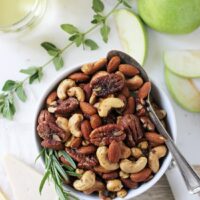 These super easy spiced rosemary and thyme nuts are a fantastic appetizer, snack or gift! Savory, a touch sweet and a tad bit spicy!