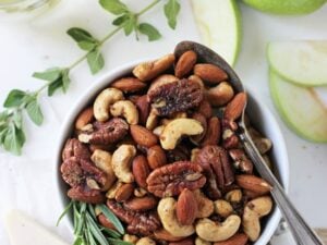 These super easy spiced rosemary and thyme nuts are a fantastic appetizer, snack or gift! Savory, a touch sweet and a tad bit spicy!