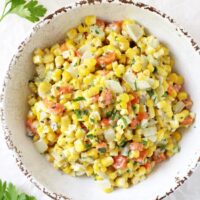 This creamy holiday corn is perfect for the season! Simple to make and filled with celery, carrots and herbs! A great make ahead dish!