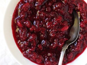 This easy homemade cranberry orange sauce is essential for the holidays! Made with maple syrup, orange zest & orange liqueur, you’ll never want the canned stuff again!