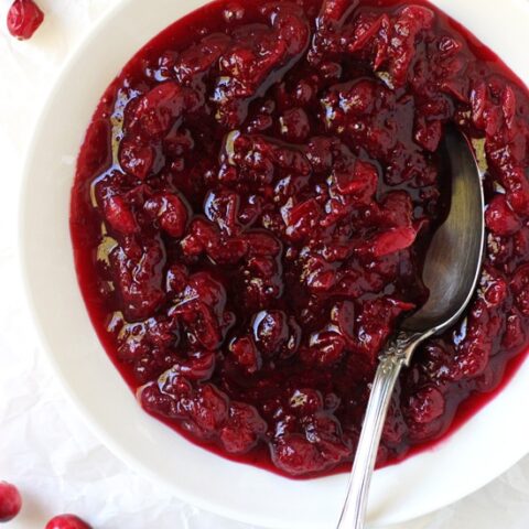 This easy homemade cranberry orange sauce is essential for the holidays! Made with maple syrup, orange zest & orange liqueur, you’ll never want the canned stuff again!