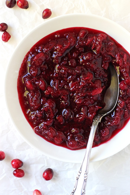 A white bowl filled with Homemade Cranberry Orange Sauce.