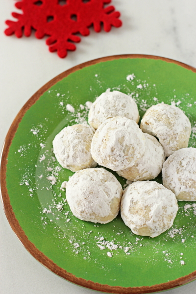 Mini Chip Snowball Cookies on a green plate.