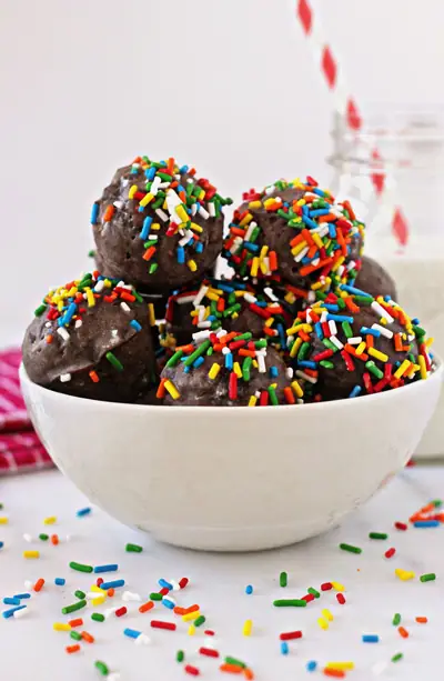 A white bowl filled with Baked Chocolate Cake Donut Holes.