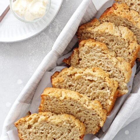 This easy buttery honey beer bread is completely addicting! Soft and chewy on the inside, crispy on the outside and filled with undertones of your favorite beer! And just 10 minutes of your time required! Vegan & dairy free options included.