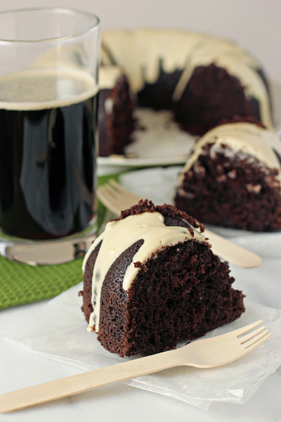 Two slices of Chocolate Beer Cake with two wooden forks.