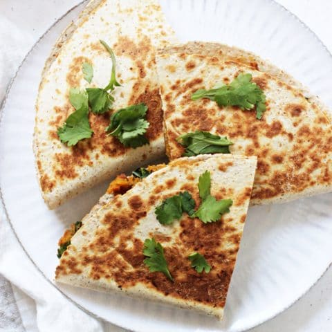 These sweet potato, black bean and kale quesadillas are a simple & healthy meal! With a creamy chipotle filling, crispy exterior and plenty of cheese! Excellent for dinner or game day! Vegan & dairy free options included!