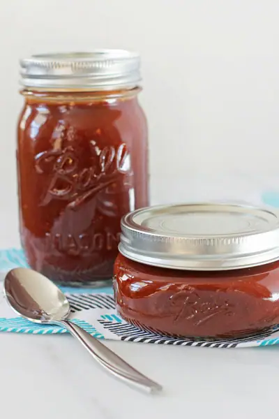 Two ball jars filled with Homemade Enchilada Sauce.