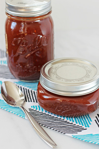 Two jars filled with Homemade Red Enchilada Sauce.