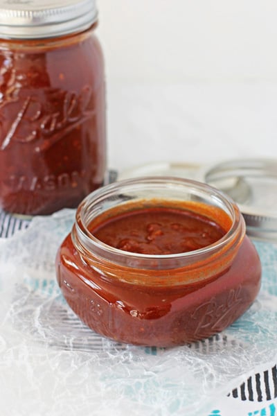 An open jar of Easy Red Enchilada Sauce.