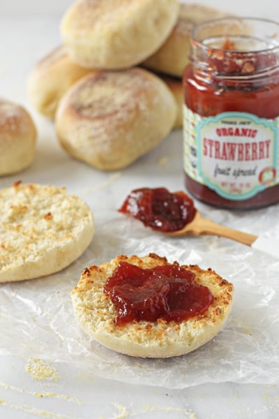 A split open Homemade English Muffin slathered with jam.