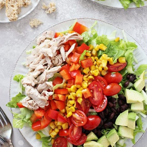 Healthy, packed with flavor and filled with fresh veggies, this chopped southwestern salad is the perfect easy dinner! Filled with shredded chicken, black beans and a dreamy cilantro vinaigrette, it’s easy and satisfying! 