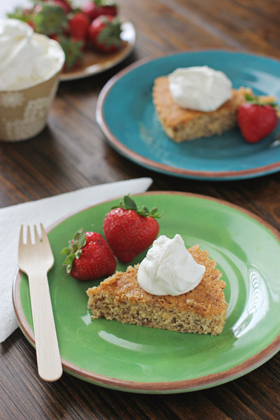 Two slices of Cornmeal Cake on colorful plates.