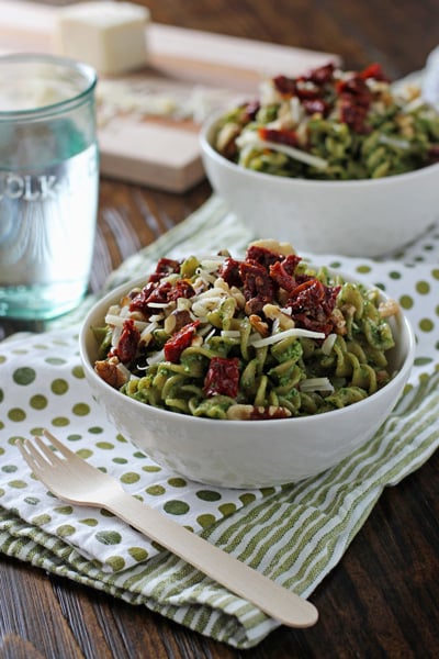 Two white bowls filled with Spinach Basil Pesto Pasta.