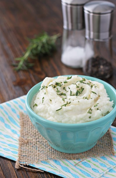 A bowl filled with Mashed Cauliflower with Cream Cheese.