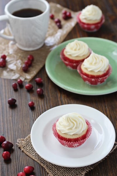 Fresh Cranberry Cupcakes on white and green plates.