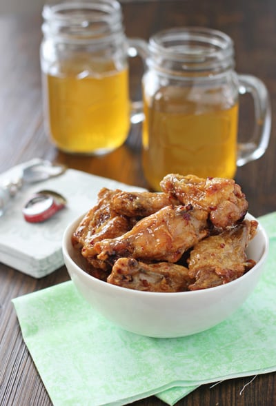 A white bowl filled with Honey Chipotle Chicken Wings.