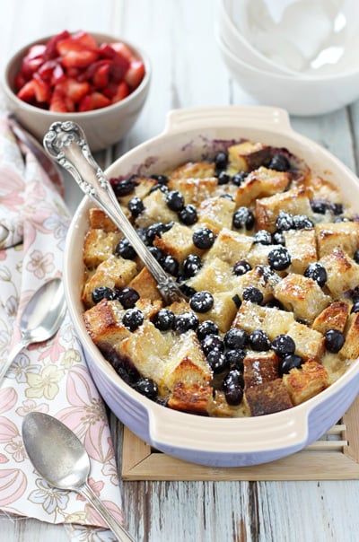A purple baking dish filled with Brie French Toast.
