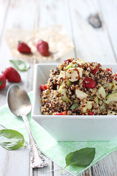 A white bowl filled with Strawberry Quinoa Salad.