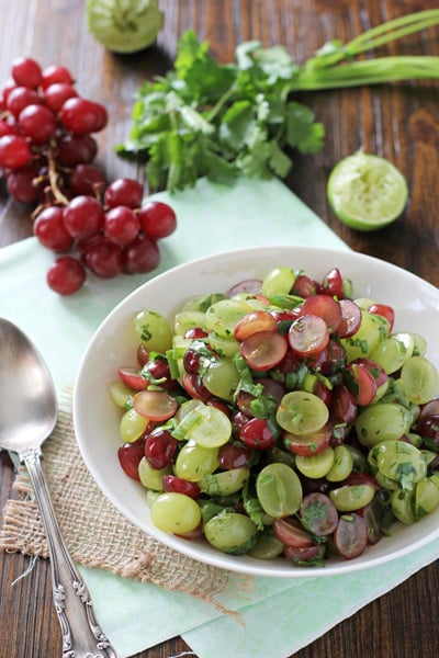 A white bowl filled with Grape Salsa.