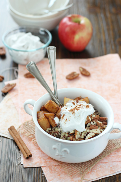 A white dish filled with Apple Cinnamon Quinoa Breakfast Bowl.