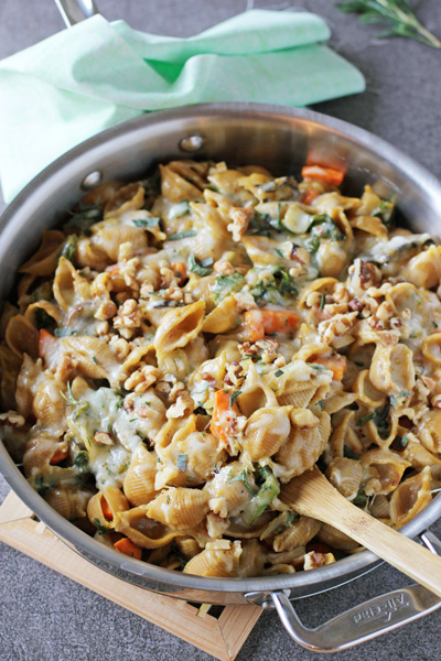 A stainless skillet filled with Butternut Squash Pasta Bake.