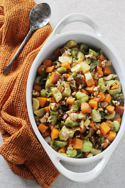 A white baking dish filled with Maple Roasted Vegetables.