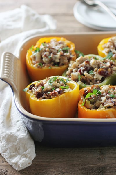 A baking dish filled with several Ground Turkey Stuffed Peppers.