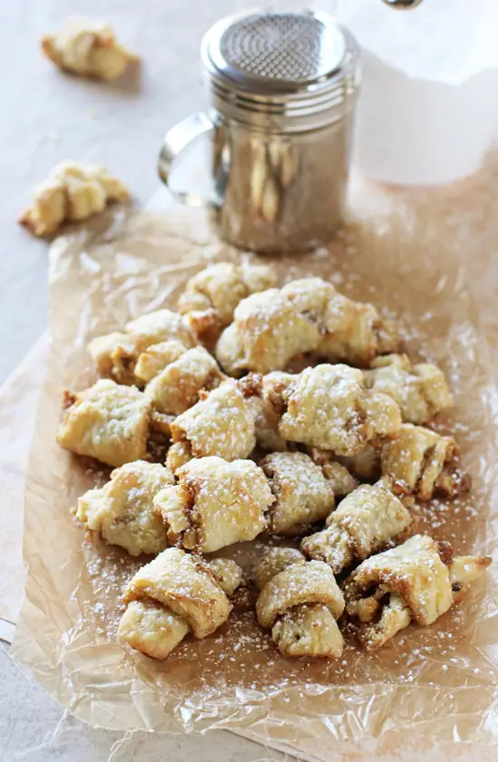 Crinkled parchment paper with a pile of Butter Horn Cookies.