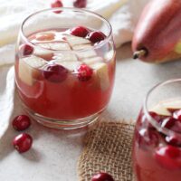 Sparkling winter champagne sangria! A festive, make-ahead holiday drink! With white wine, champagne, cranberry juice, fresh fruit and a spiced simple syrup!