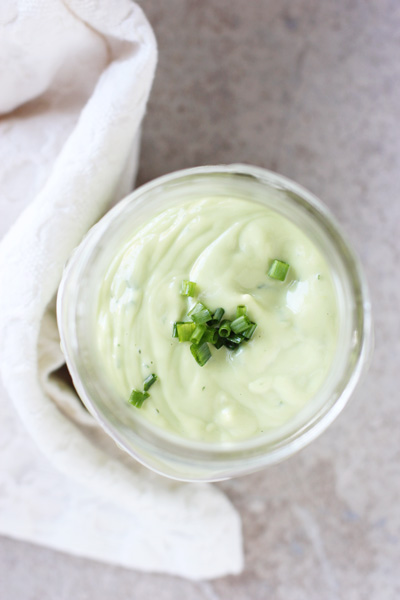 A jar filled with Avocado Ranch Dressing.