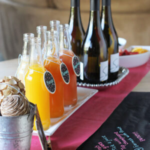 Learn how to set up a DIY mimosa bar for parties! Simple, yet impressive. Perfect for showers and brunches!