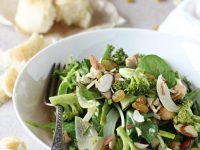 Recipe for a simple roasted spring veggie salad. Filled with asparagus and broccoli and a creamy tahini dressing. With golden raisins and sliced almonds!
