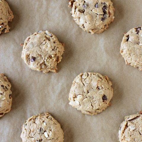 Recipe for one-bowl, naturally sweetened flourless peanut butter trail mix cookies. Gluten-free and full of nuts, chocolate chips and raisins!