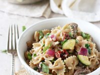 Recipe for mediterranean farfalle pasta salad. A light and flavorful dish that is delicious served hot or cold! Filled with veggies, herbs and a lemon mustard dressing.