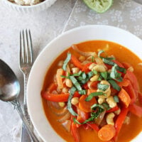 Recipe for vegetarian thai red curry with peppers and cashews. A creamy weeknight curry made with chickpeas, bell peppers and coconut milk!