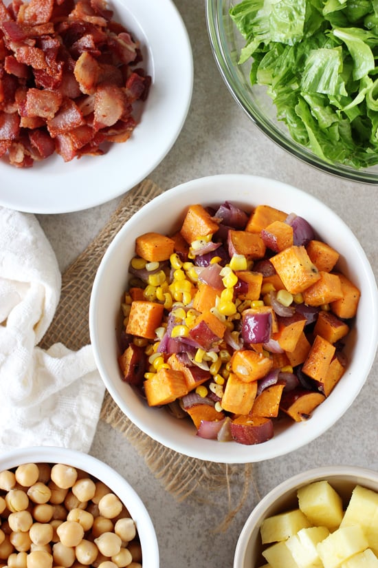 Small white bowls filled with the components of BBQ Chickpea Salad.