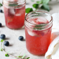 Recipe for blueberry mint sparkling lemonade. A fun summer treat! Refined sugar free and made with fresh blueberries!