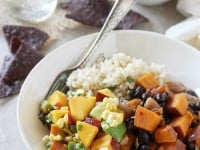 Recipe for sweet & spicy chipotle sweet potato burrito bowls with a fresh peach salsa! With cilantro lime rice and black beans!