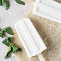 Recipe for creamy coconut mojito ice pops! Made with coconut milk, lime, maple syrup and vanilla bean! Vegan and dairy free!