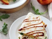 Recipe for quick & easy peach and white bean quesadillas. With a basil-packed white bean spread, fresh peaches, arugula and balsamic glaze!