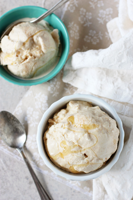 Two bowls of Honey Peanut Butter Ice Cream with a spoon in one dish.