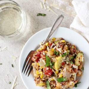 Recipe for light yet filling summer squash and corn quinoa. Filled with zucchini, squash, corn and even goat cheese! A great main or side!